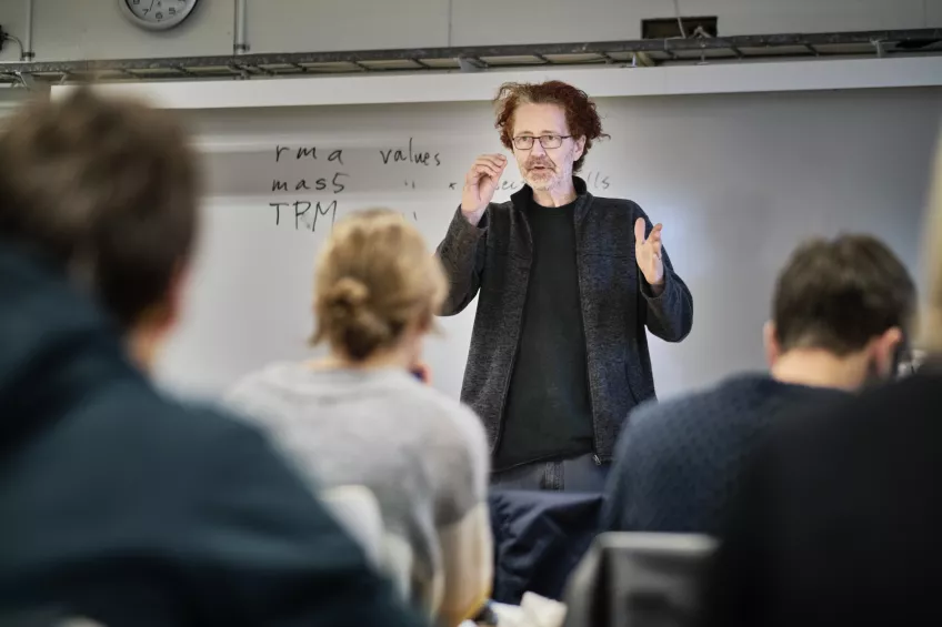 Professor teaches MSc students in seminar room